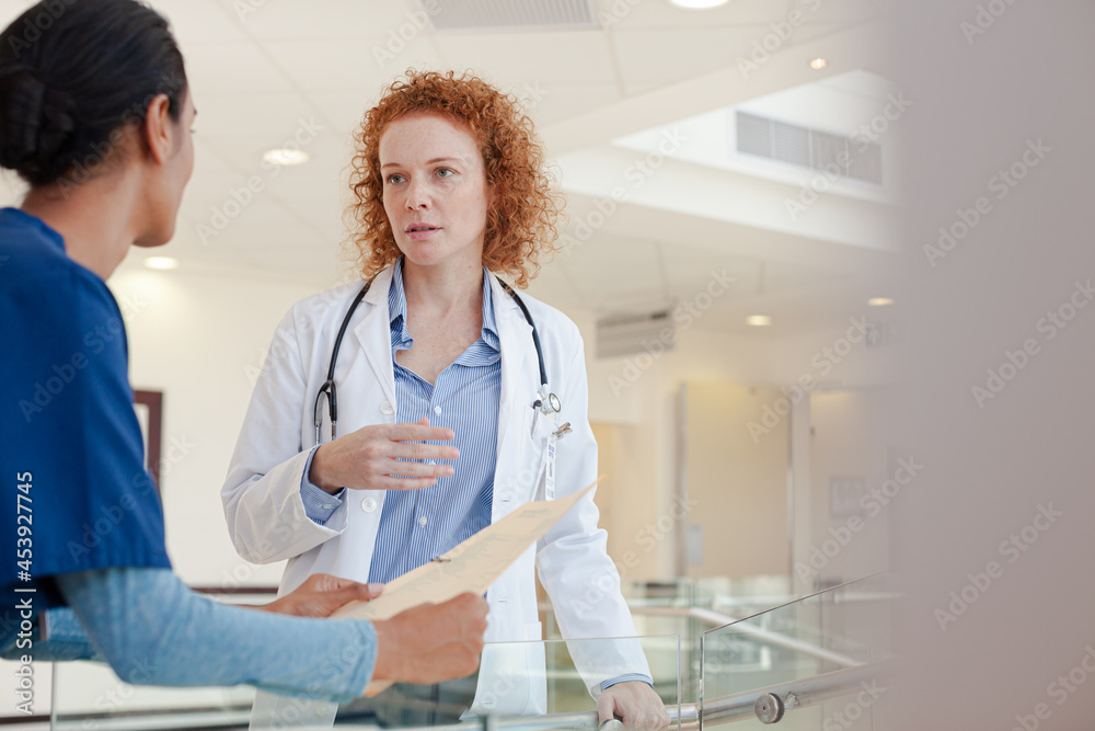 Fototapeta premium Doctor and nurse talking in hospital
