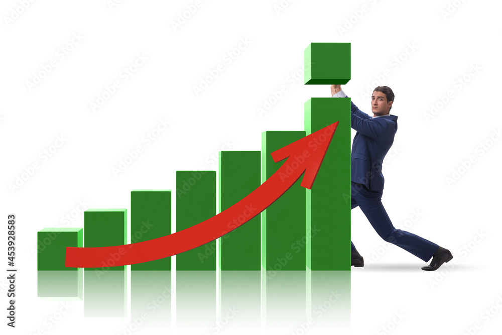 Businessman supporting economic growth on chart Businessman supporting economic growth on chart