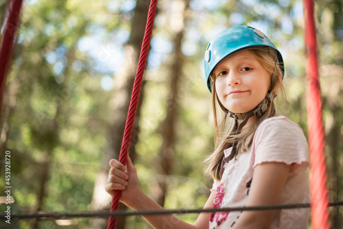 child climbing on tree