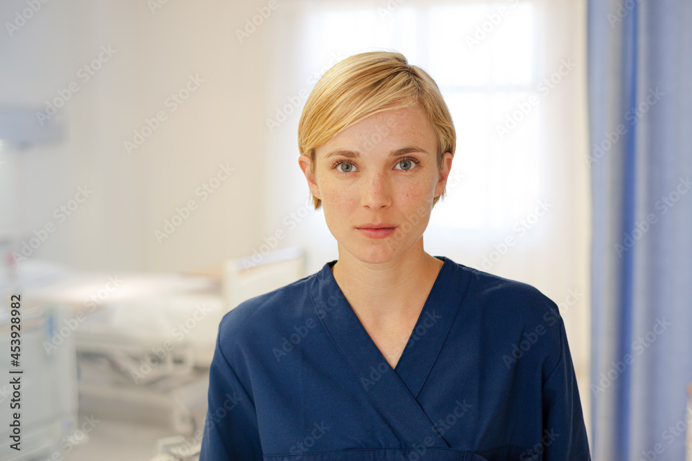 Nurse standing in hospital hallway Nurse standing in hospital hallway