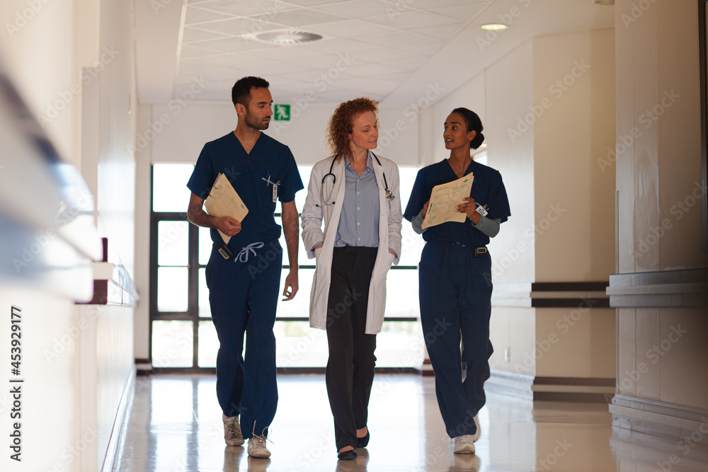 Hospital staff walking in hallway Hospital staff walking in hallway
