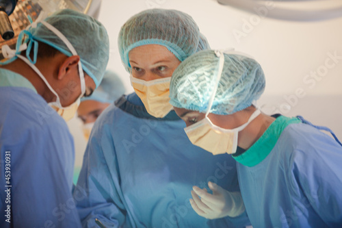 Surgeons working in operating room