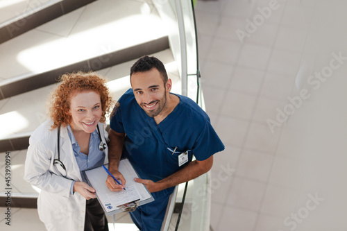 Doctor and nurse on hospital steps