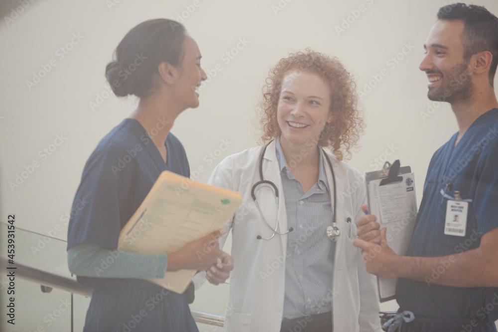 Fototapeta premium Hospital staff talking near staircase