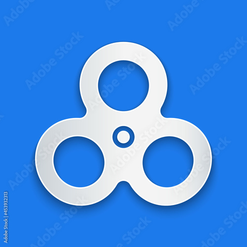 Paper cut Fidget spinner icon isolated on blue background. Stress relieving toy. Trendy hand spinner. Paper art style. Vector