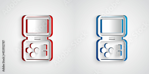 Paper cut Portable tetris electronic game icon isolated on grey background. Vintage style pocket brick game. Interactive playing device. Paper art style. Vector