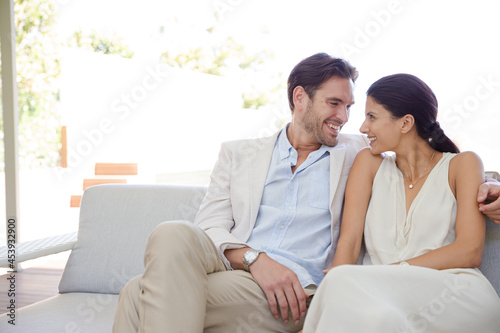 Portrait of smiling couple on sofa