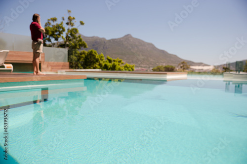 Man standing at poolside