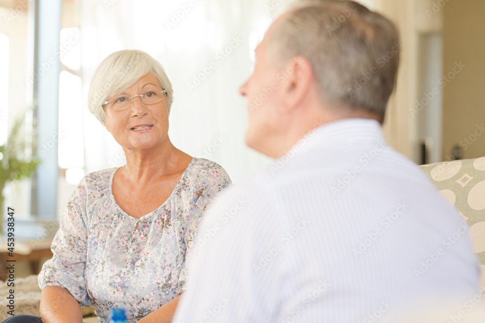 Older couple talking and smiling