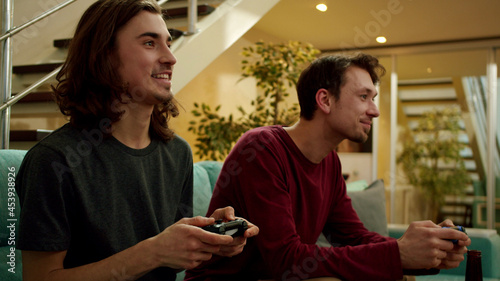 Two friends are playing games and laughing 