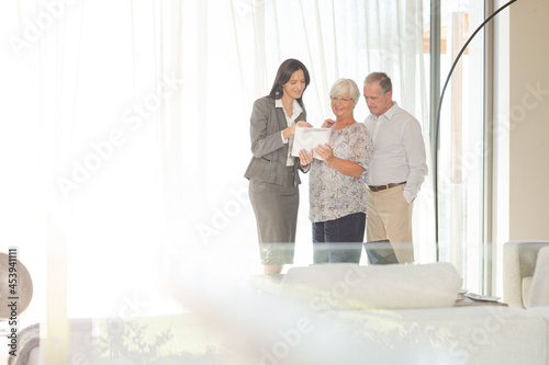 Financial advisor talking to couple indoors