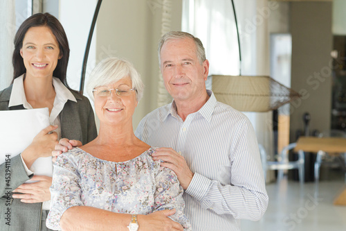 Financial advisor posing with clients