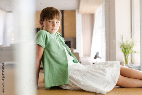 Girl sitting on table