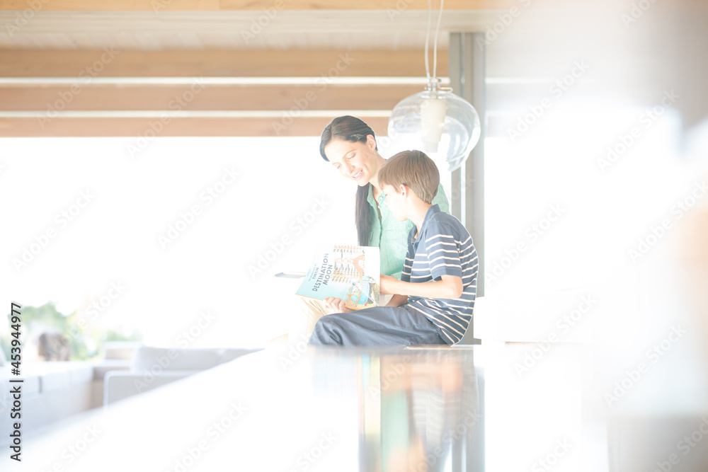 Mother and son posing in modern house Mother and son posing in modern house