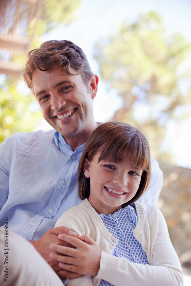 Father and daughter hugging outdoors Father and daughter hugging outdoors