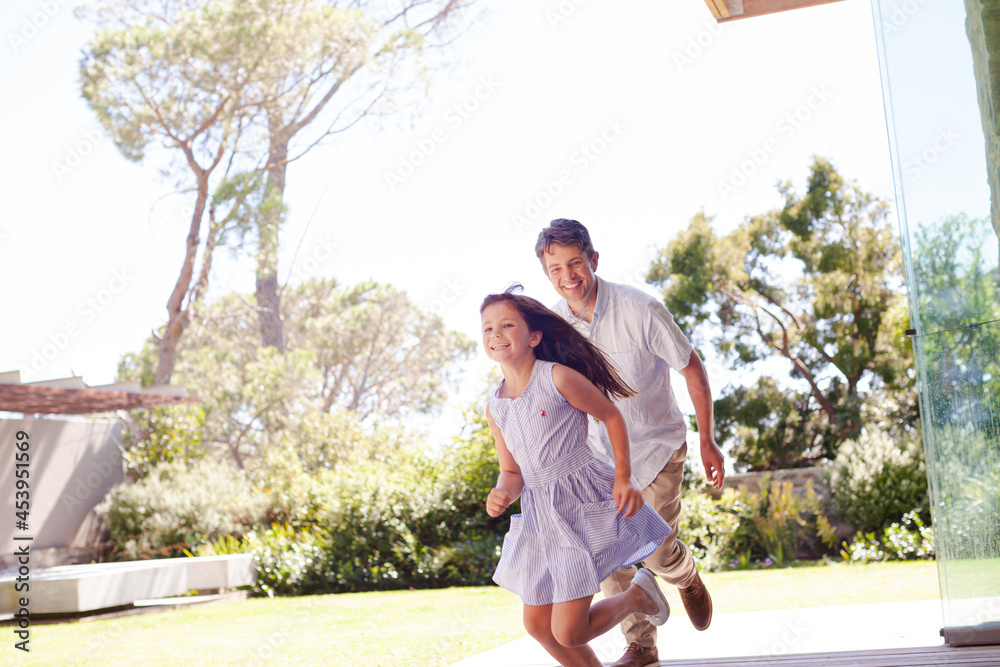 Fototapeta premium Father and daughter playing outdoors