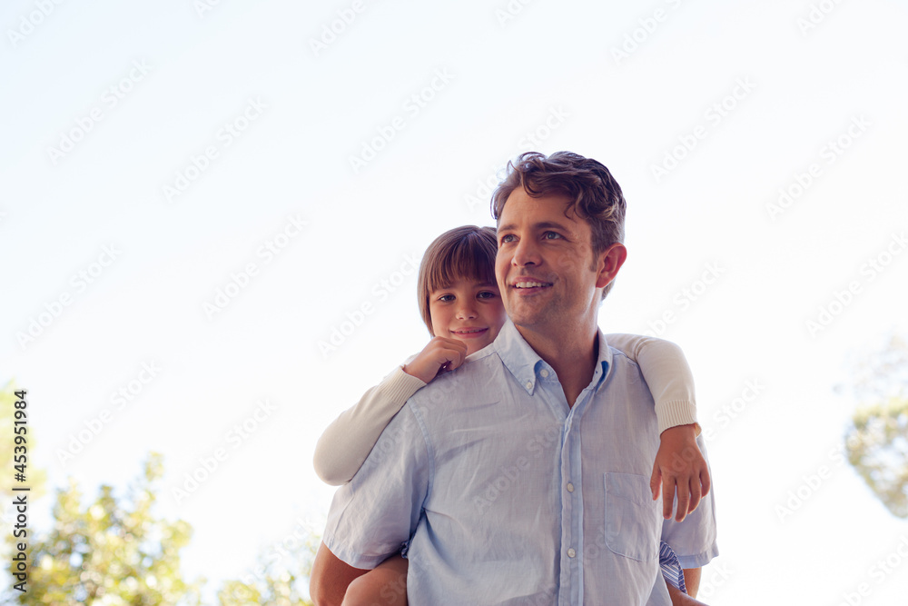 Father and daughter hugging outdoors Father and daughter hugging outdoors