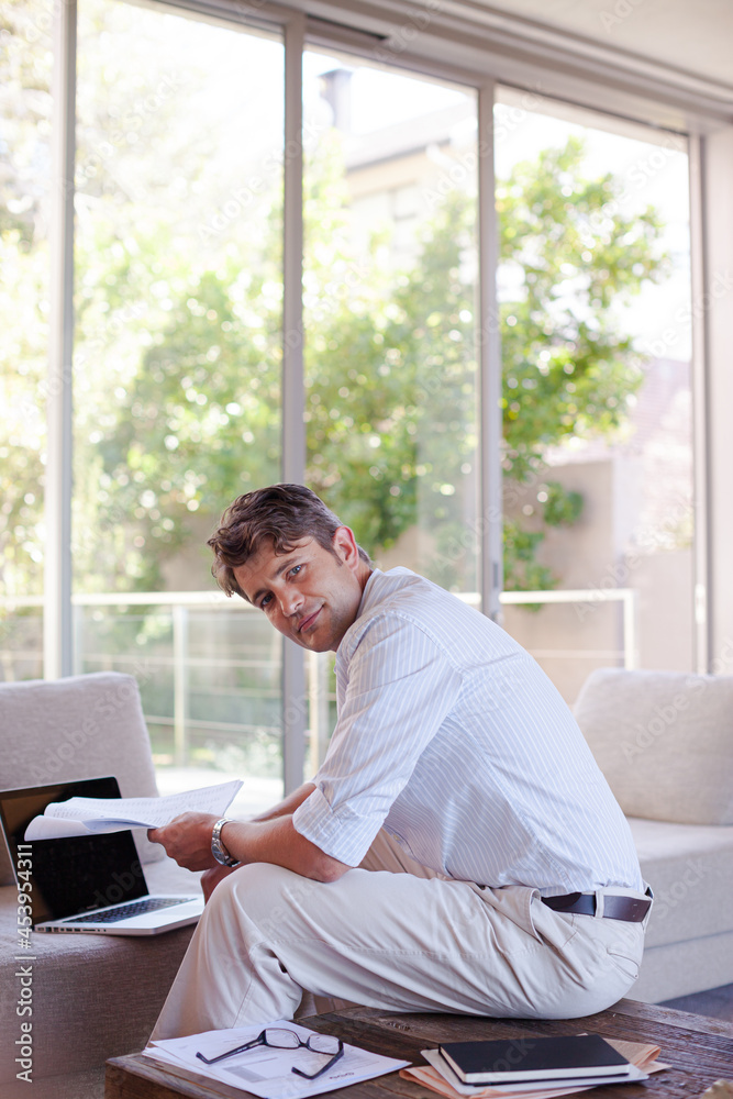 Businessman using laptop on sofa Businessman using laptop on sofa