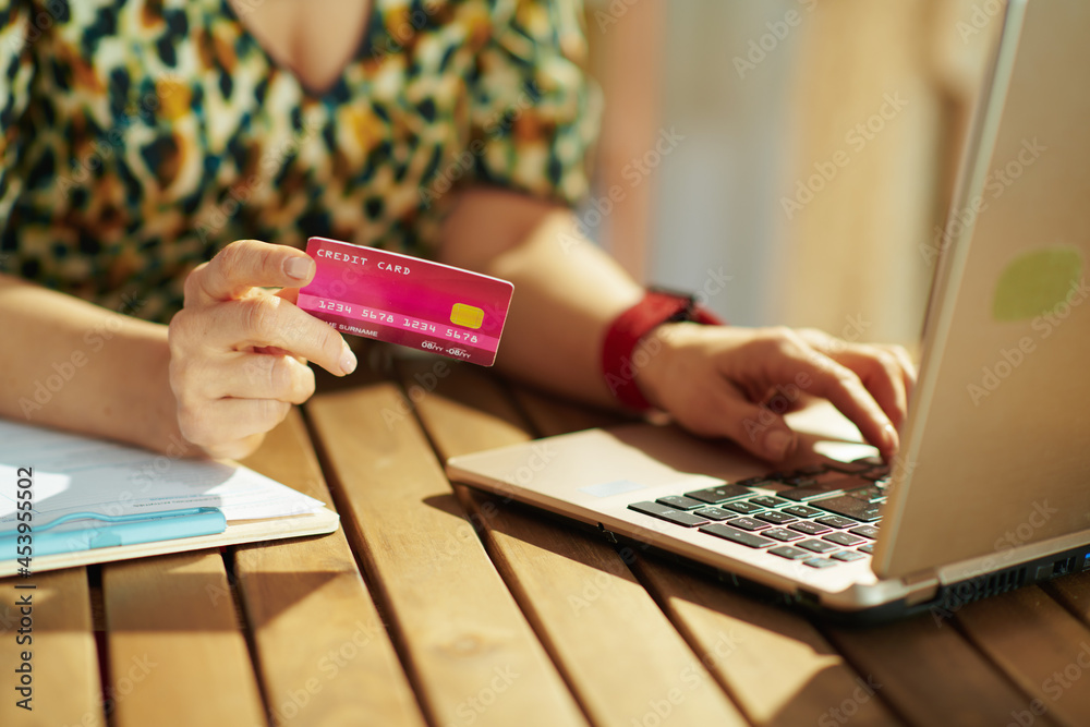 Fototapeta premium Trendy business owner woman buying on internet in office