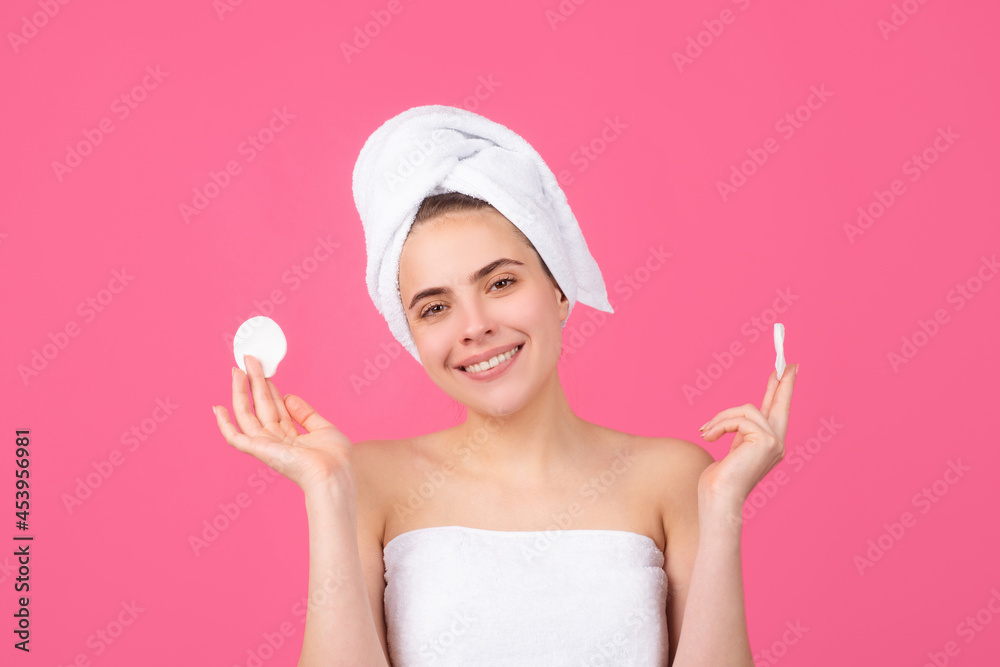 Closeup face of beautiful young smiling woman with bath towel on head. Beautiful woman face isolated on studio. Natural cosmetics and skincare. Beautiful woman woman in spa salon. Closeup face of beautiful young smiling woman with bath towel on head. Beautiful woman face isolated on studio. Natural cosmetics and skincare. Beautiful woman woman in spa salon.