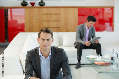 Businessman having cup of coffee in office