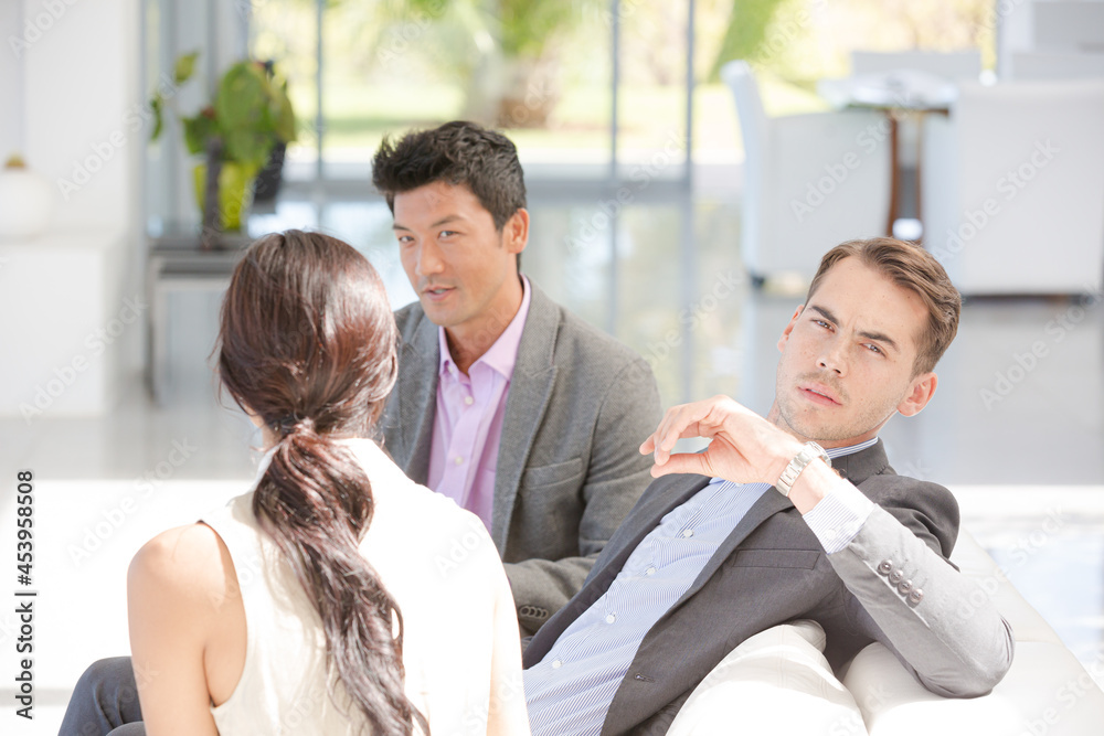 Businessman smiling in meeting Businessman smiling in meeting