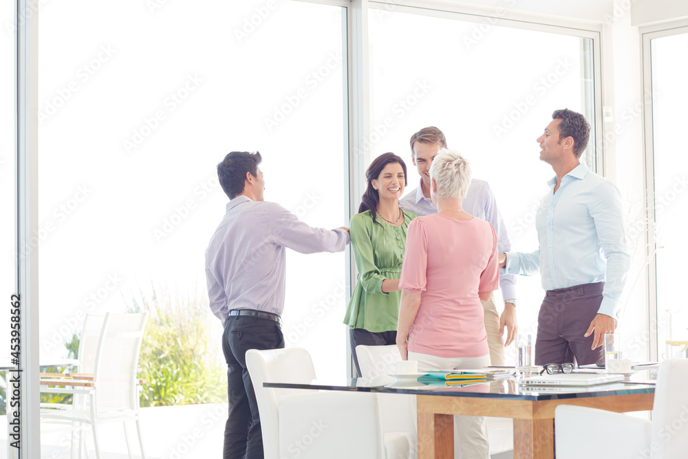 Business people cheering in office Business people cheering in office