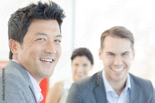 Business people smiling on sofa