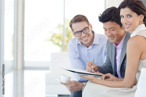 Business people smiling on sofa