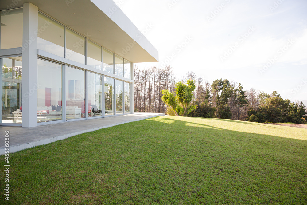 Modern building overlooking manicured lawn Modern building overlooking manicured lawn