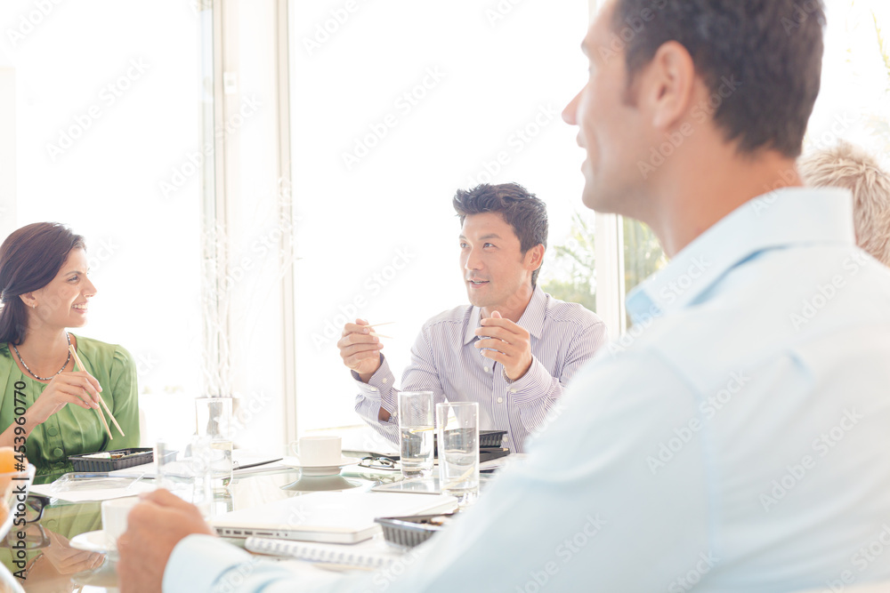 Fototapeta premium Business people smiling in lunch meeting