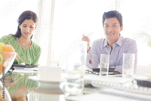 Business people smiling in lunch meeting