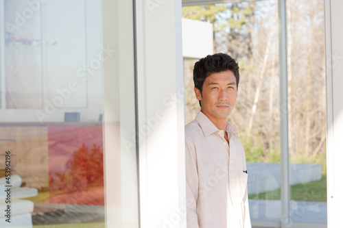 Businessman standing at office window