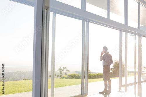 Businessman talking on cell phone outdoors