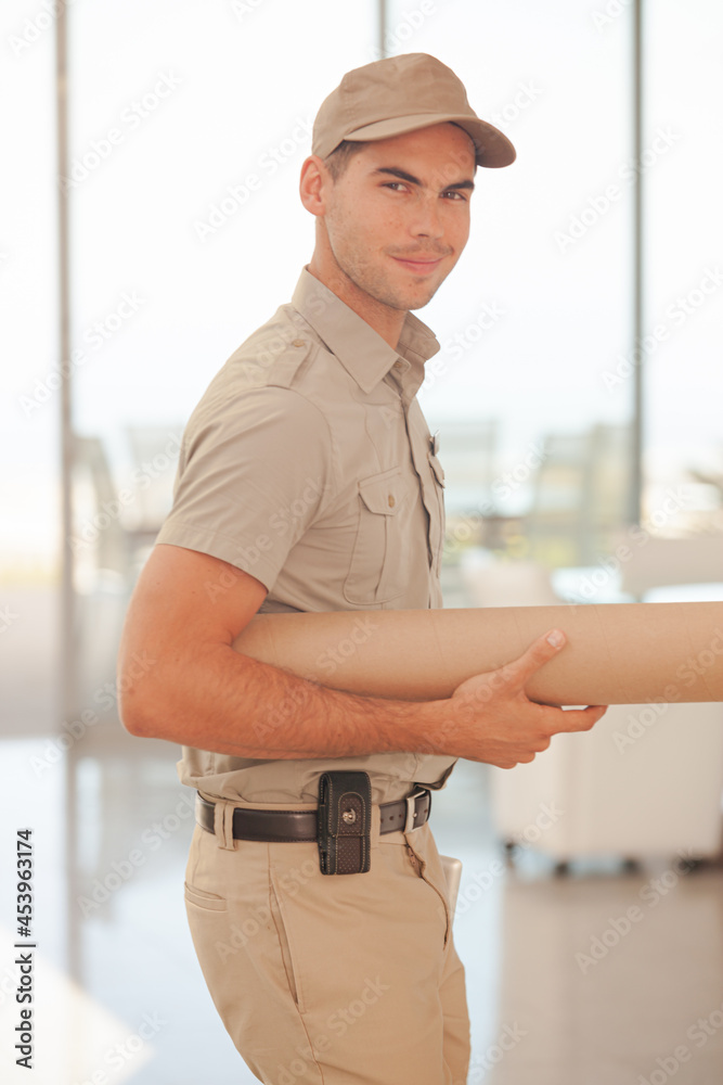 Delivery boy carrying package Delivery boy carrying package