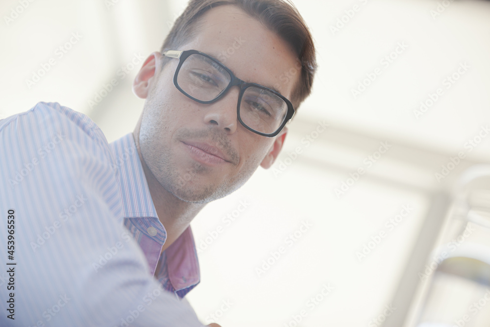 Businessman smiling in office Businessman smiling in office