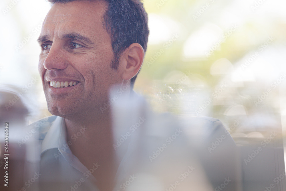 Businessman smiling in office Businessman smiling in office