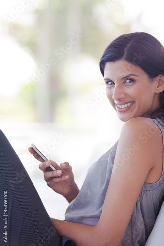 Businesswoman using cell phone