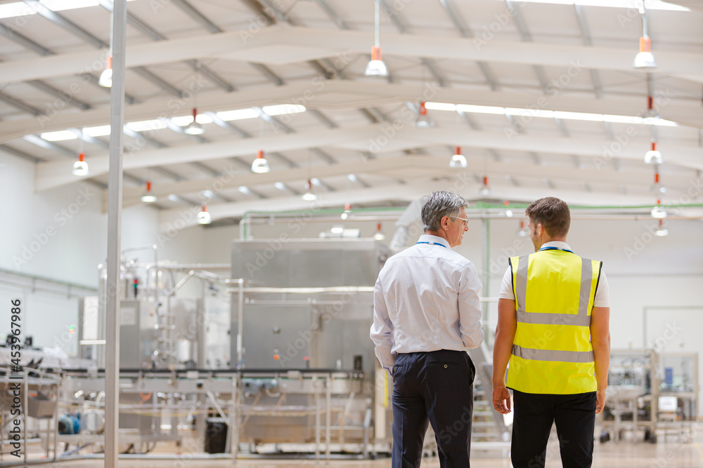 Supervisor and worker talking in warehouse Supervisor and worker talking in warehouse