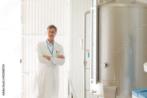 Scientist smiling in food processing plant
