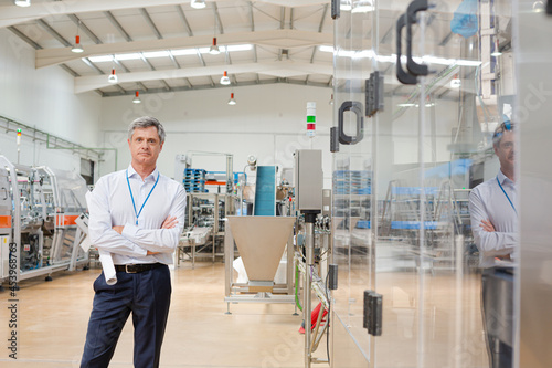 Businessman standing in factory