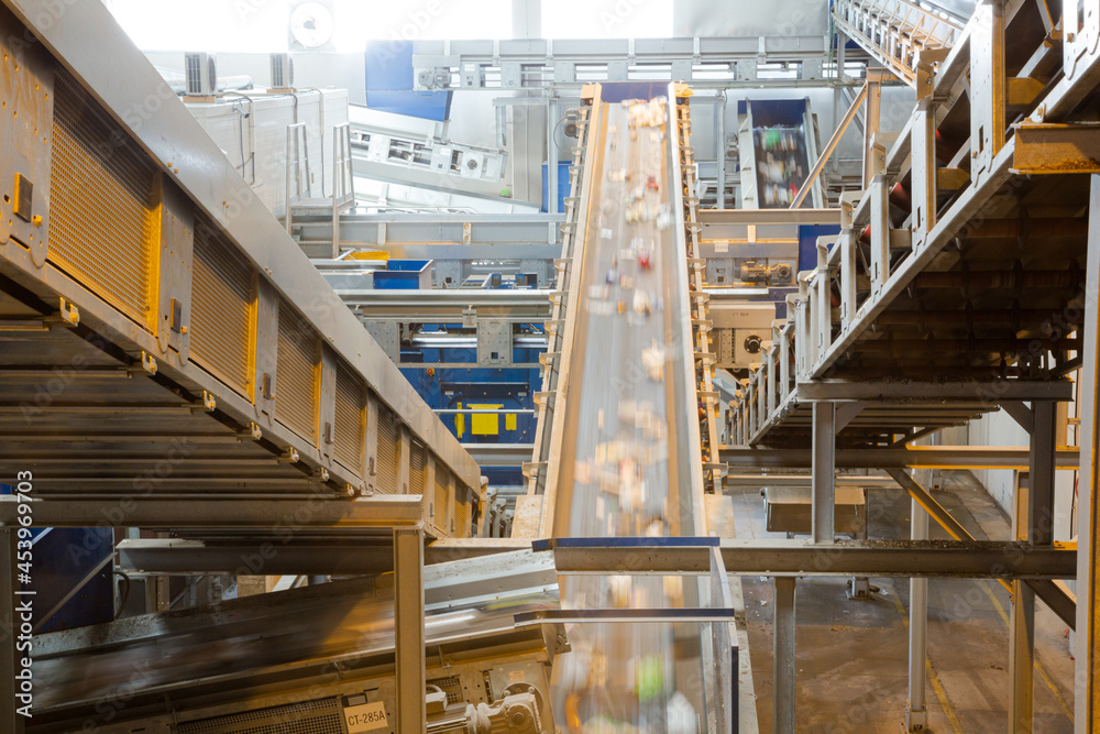 Fototapeta premium Recycled material on conveyor belt in recycling center