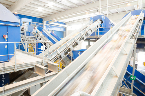 Recycled material on conveyor belt in recycling center