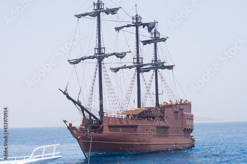 sailing ship on the waters of the Red Sea. Tourist entertainment, a tour of the coast. A sunny summer day - Egypt, Sharm el-Sheikh, Red Sea-August 05, 2021