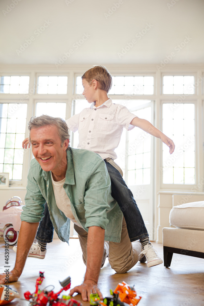 Obraz premium Father and son playing with toys