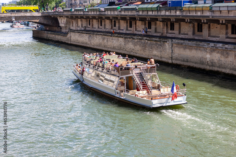 A pleasure boat on the Seine River. Paris, France