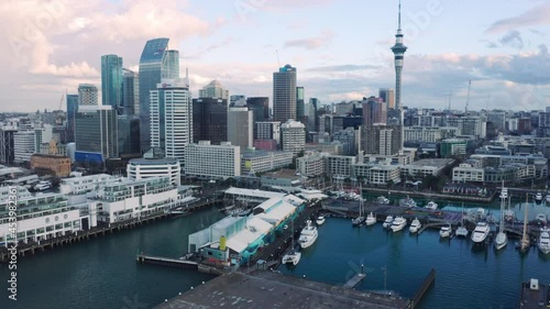 Aerial: Downtown Auckland city skyline and Viaduct harbour during Covid Delta variant lockdown, New Zealand photo