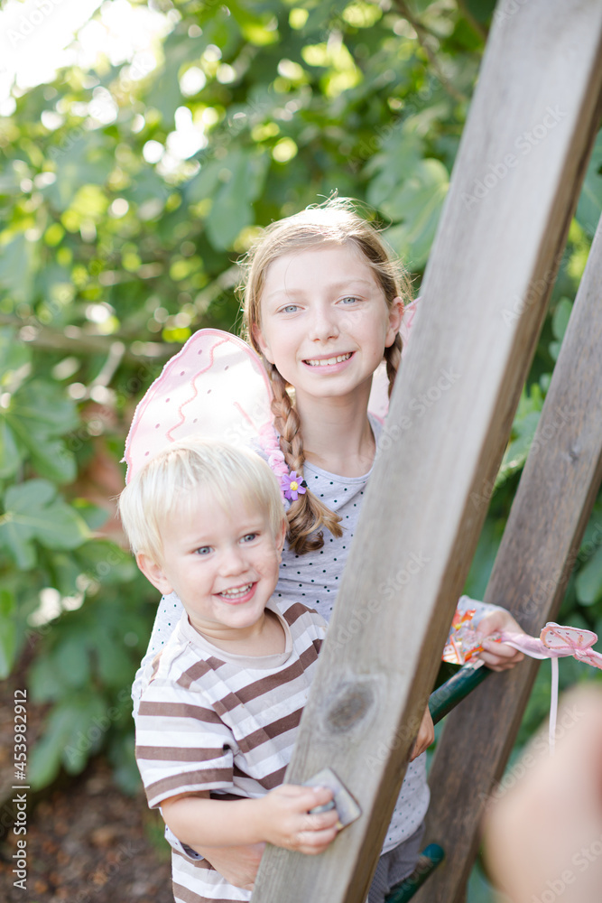 Fototapeta premium Children playing together on playset