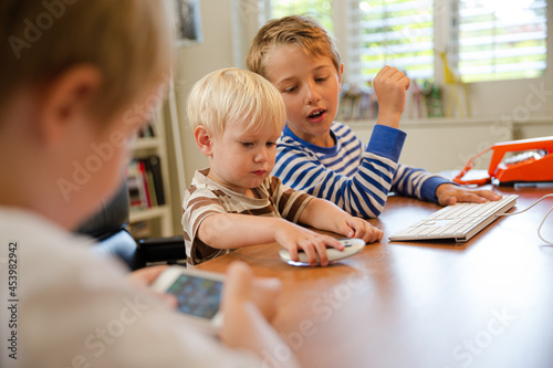 Boys working in home office