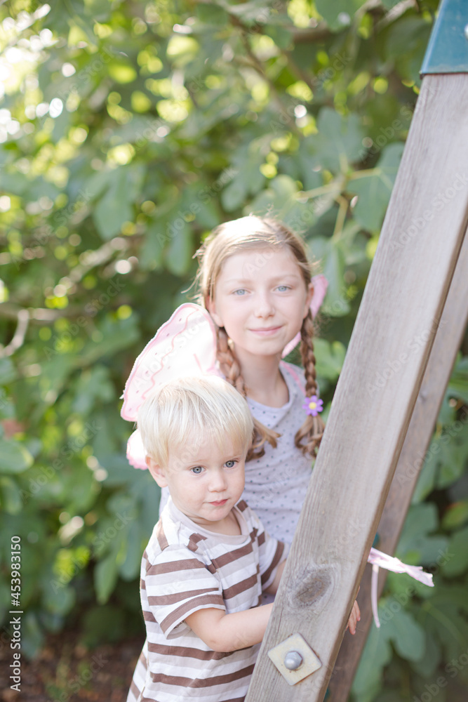 Fototapeta premium Children playing together on playset